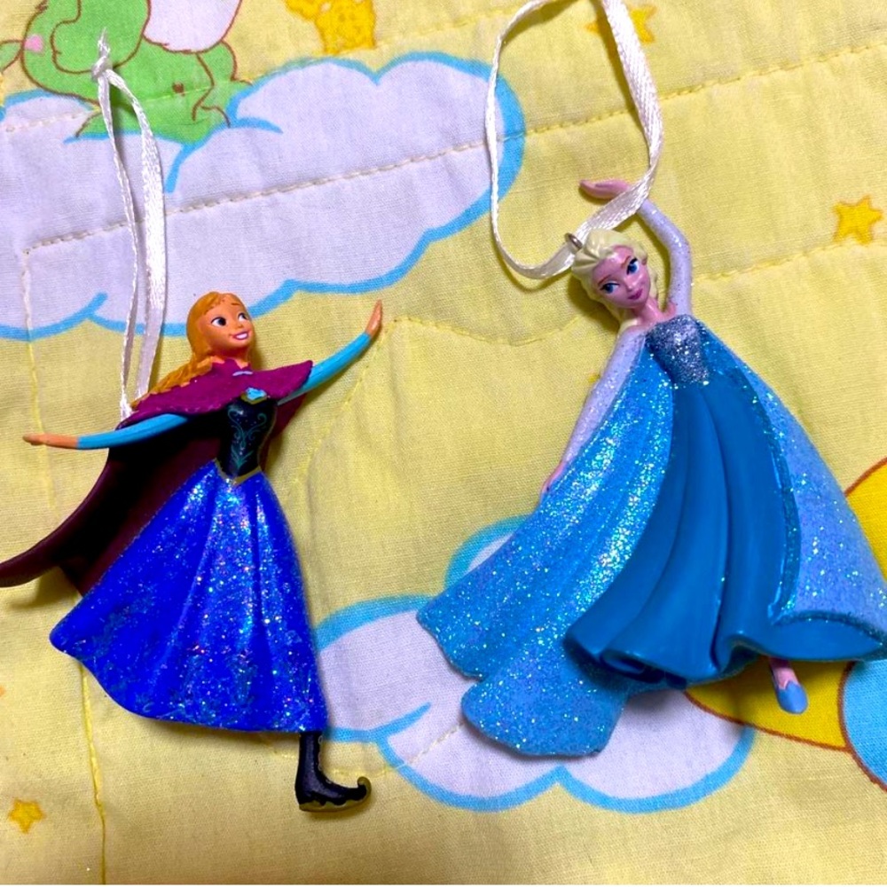 Disney 
licensed anna and elsa from frozen 
ornaments